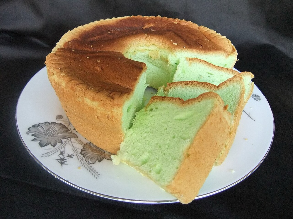 A pandan chiffon cake, cut to show its crumb